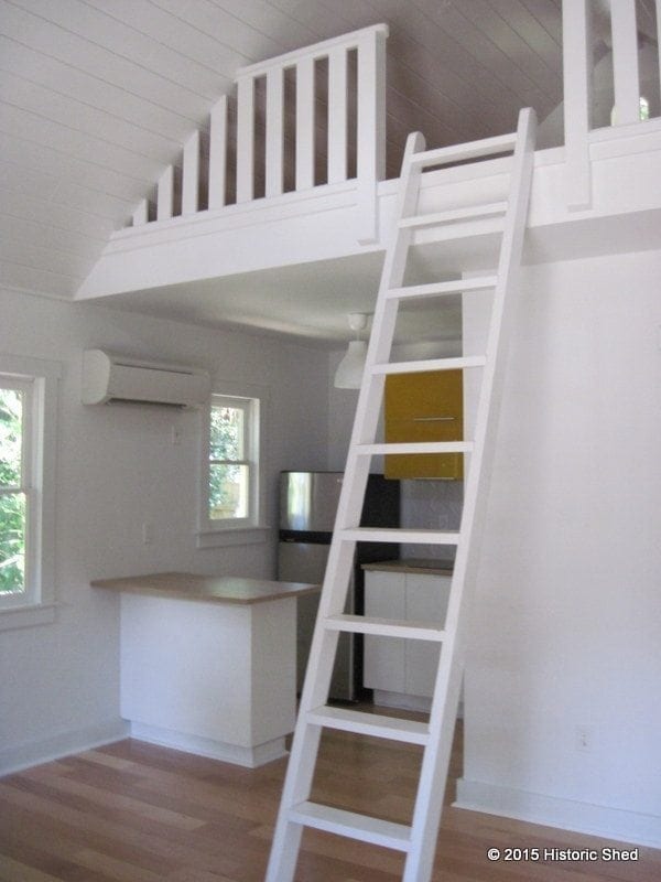 The steep roof allowed a storage loft to be placed over the kitchen and bath area