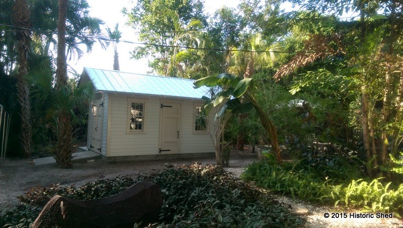 The shed sits nicely in the lushly landscaped yard