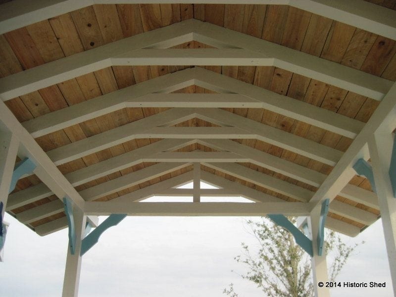 The 1x6 cypress roof sheathing was left exposed and unpainted to accentuate the 3x6 rafters.